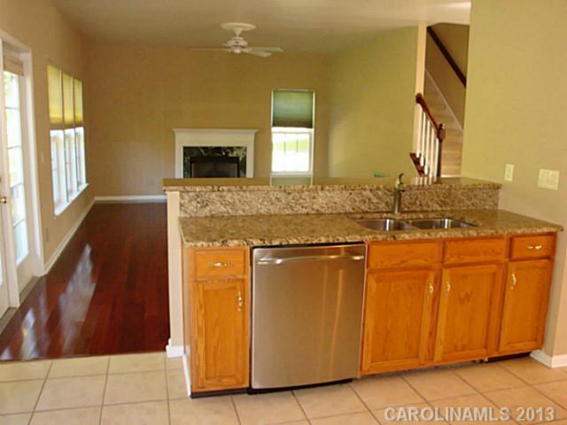3741 Marbury Road Charlotte, NC 28269 - Photo 7 of 16 a bathroom with a granite countertop sink and a mirror