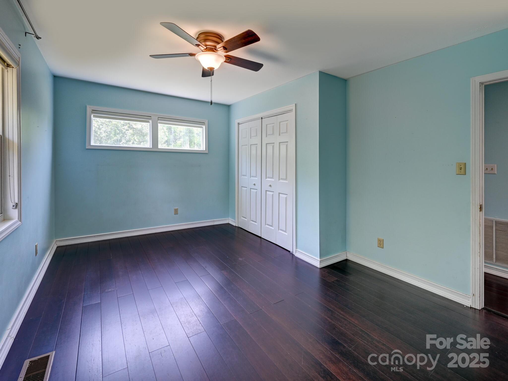 14 Spring Lake Drive Fletcher, NC 28732 - Photo 16 of 29 a view of an empty room with wooden floor and a window