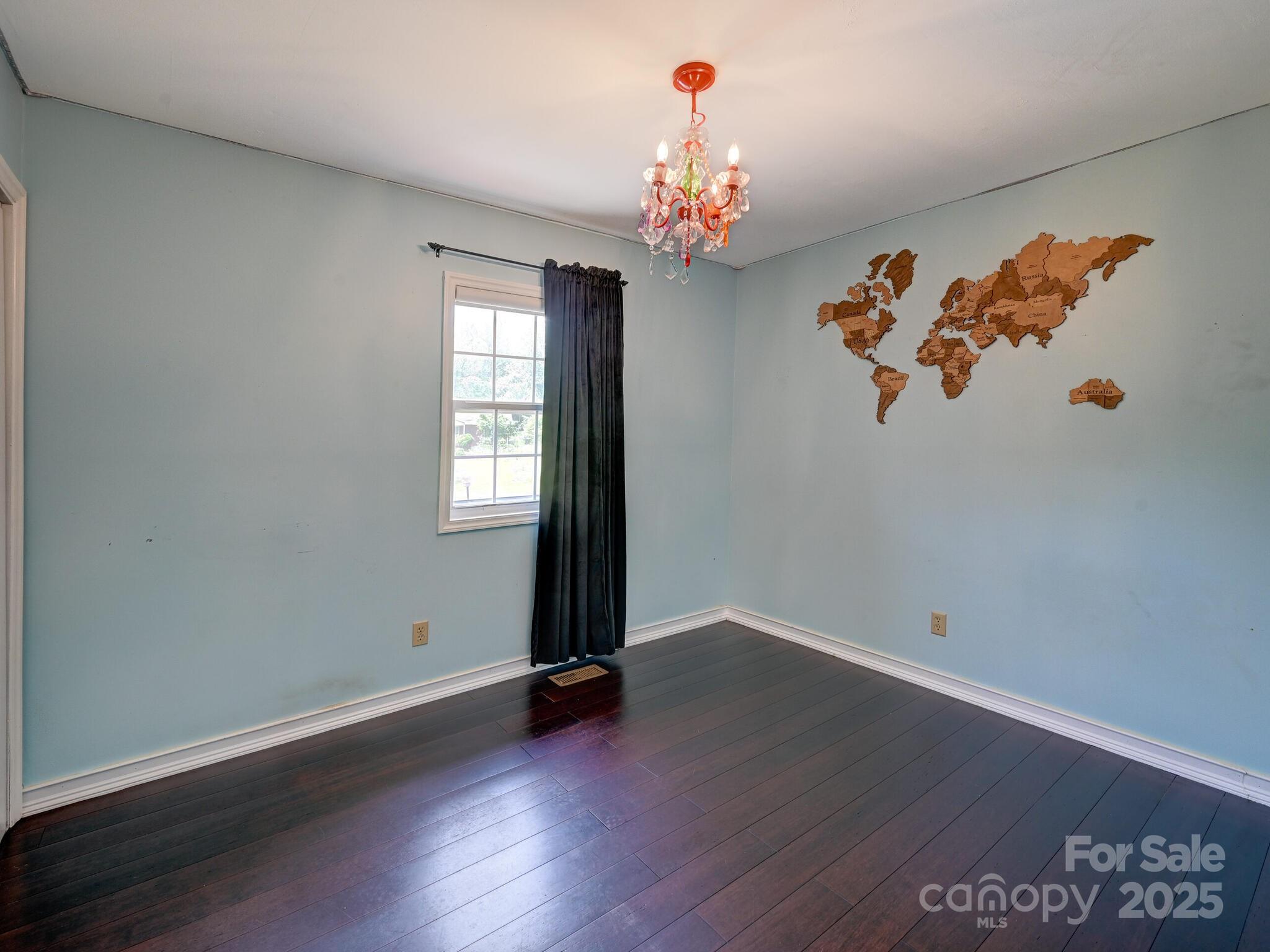 14 Spring Lake Drive Fletcher, NC 28732 - Photo 20 of 29 an empty room with wooden floor and window