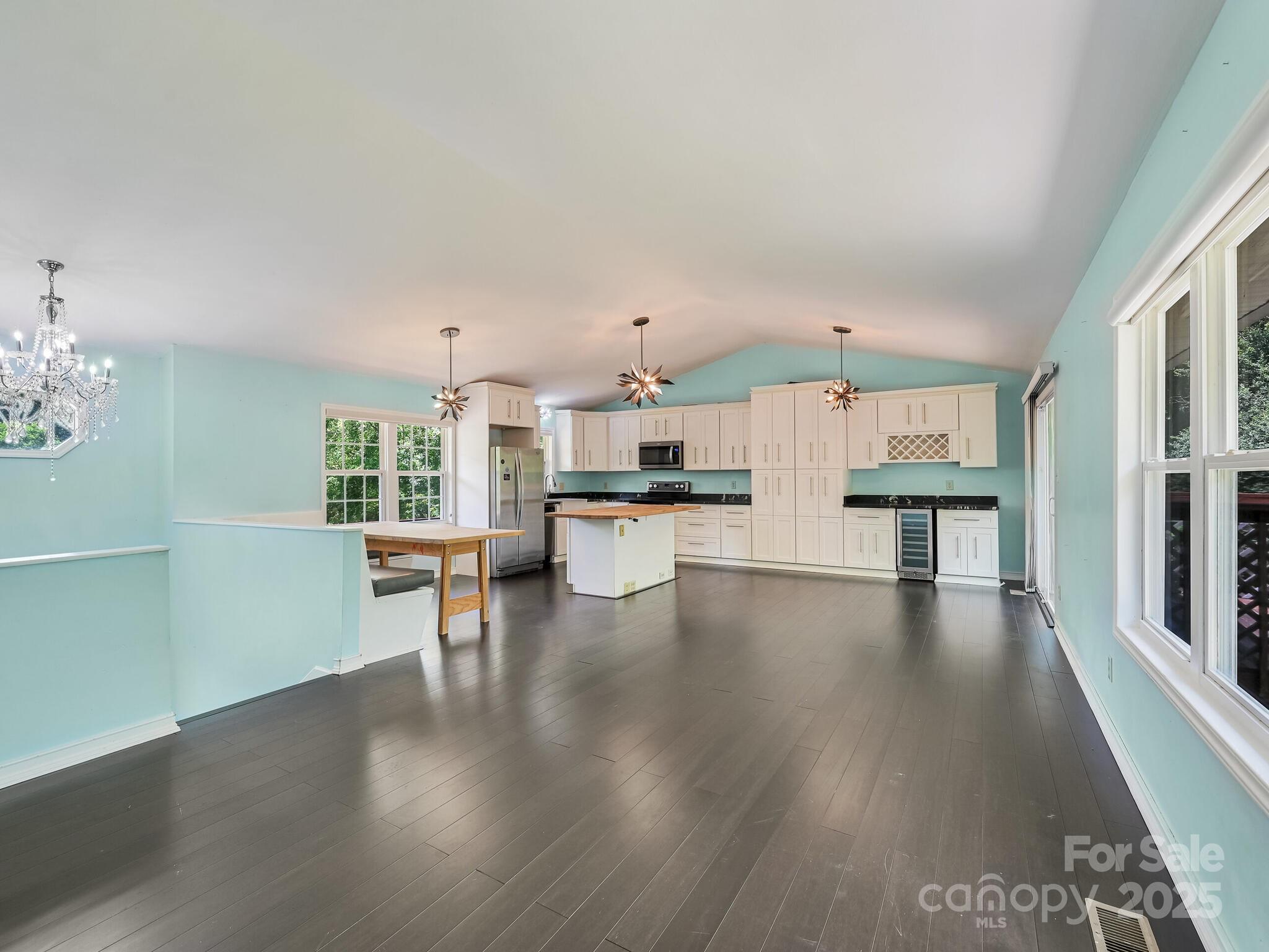 14 Spring Lake Drive Fletcher, NC 28732 - Photo 4 of 29 a open kitchen with white cabinets and wooden floor