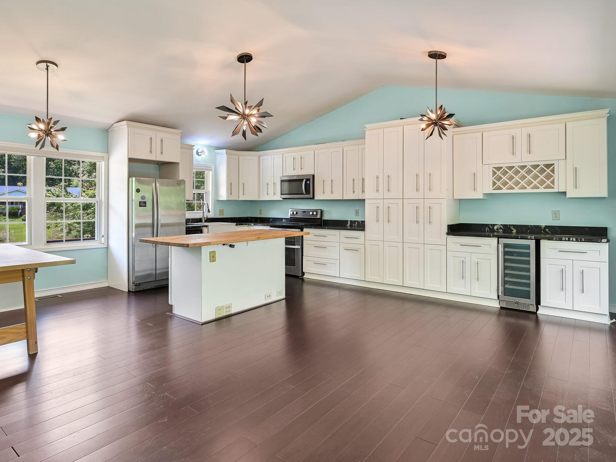 14 Spring Lake Drive Fletcher, NC 28732 - Photo 7 of 29 a kitchen with stainless steel appliances granite countertop a stove refrigerator and a wooden floor