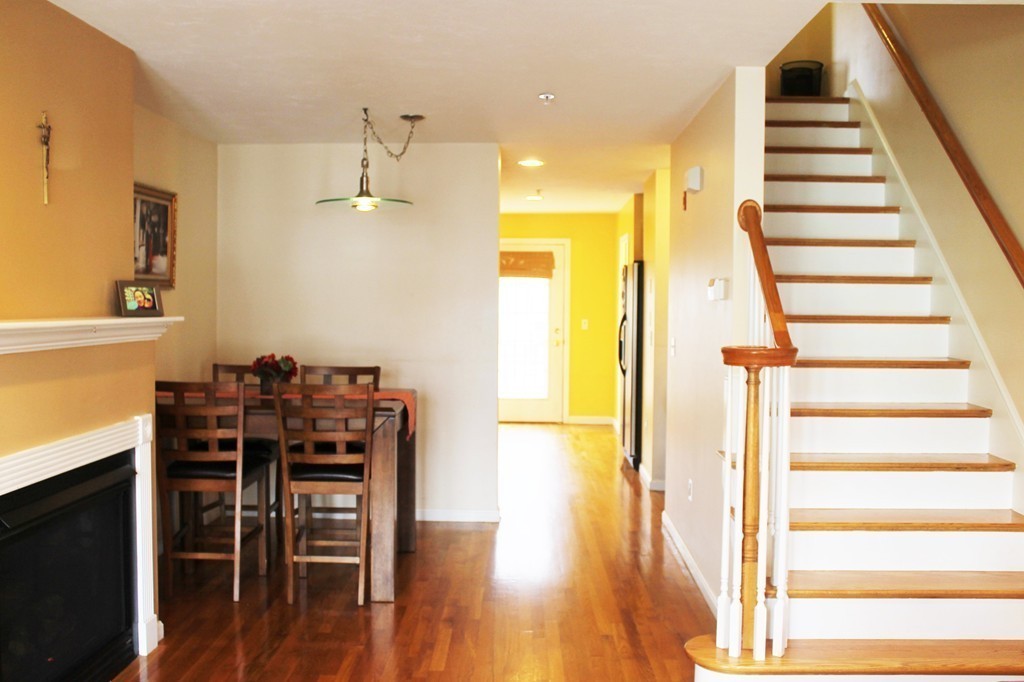 47 Alder Street, Unit 9 Waltham, MA 02453 - Photo 4 of 23 a view of a dining room with furniture and wooden floor