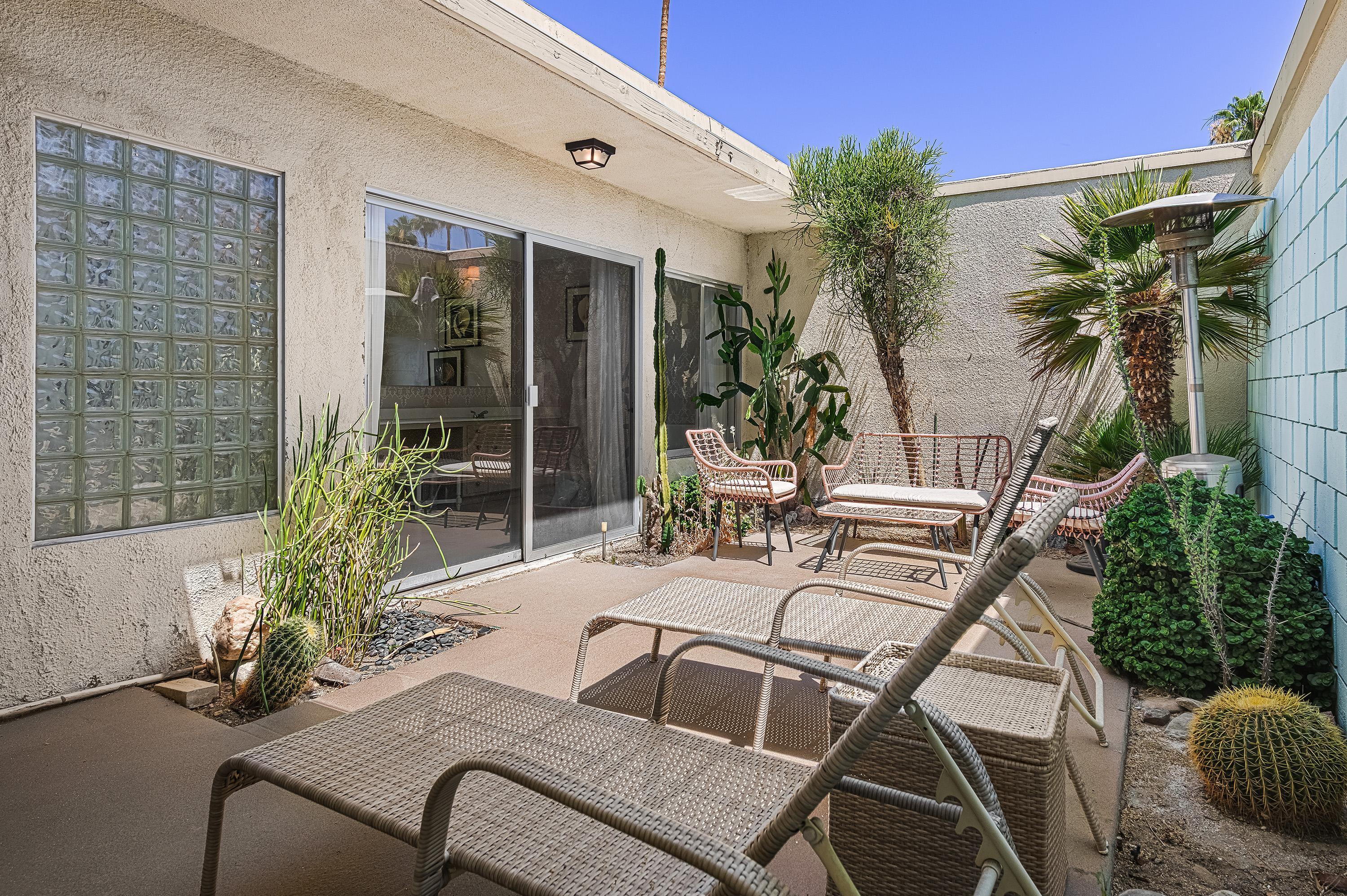 1855 Ramon Road, Unit 14 Palm Springs, CA 92264 - Photo 23 of 34 a view of a backyard with a patio