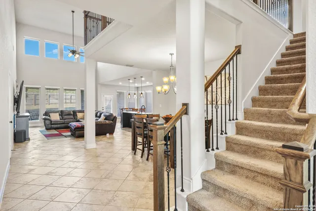 a view of a livingroom with furniture and floor to ceiling window