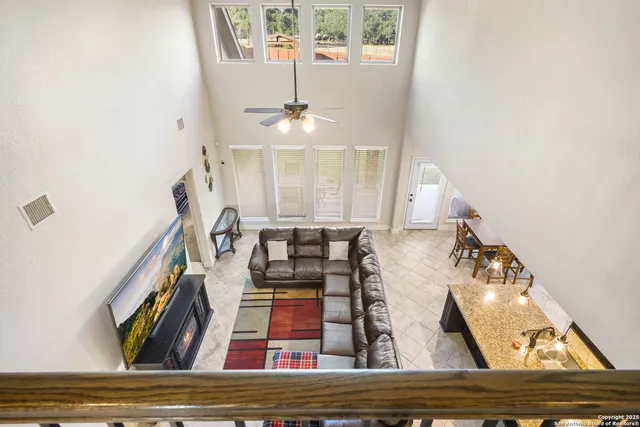 a view of living room with furniture and wooden floor