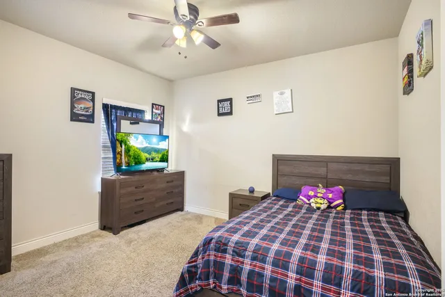 a bedroom with a bed and a dresser