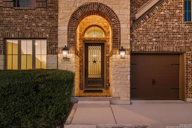 a view of a brick house with many windows