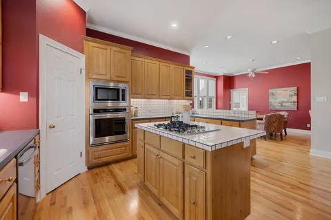 a kitchen with a stove a sink and a refrigerator