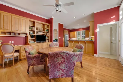 a living room with stainless steel appliances kitchen island granite countertop furniture and a kitchen view