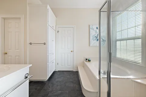a bathroom with a sink and shower
