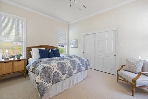 a bedroom with a bed and a couch