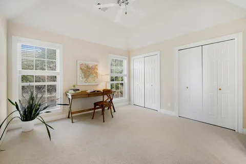 a workspace with furniture and a window