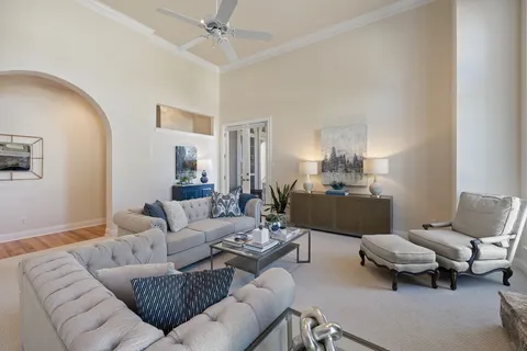 a living room with furniture and a view of bedroom