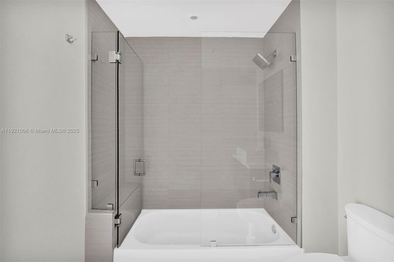 1010 Southwest 2nd Avenue, Unit 1004 Miami, FL 33130 - Photo 18 of 45 a bathroom with a tub and a shower