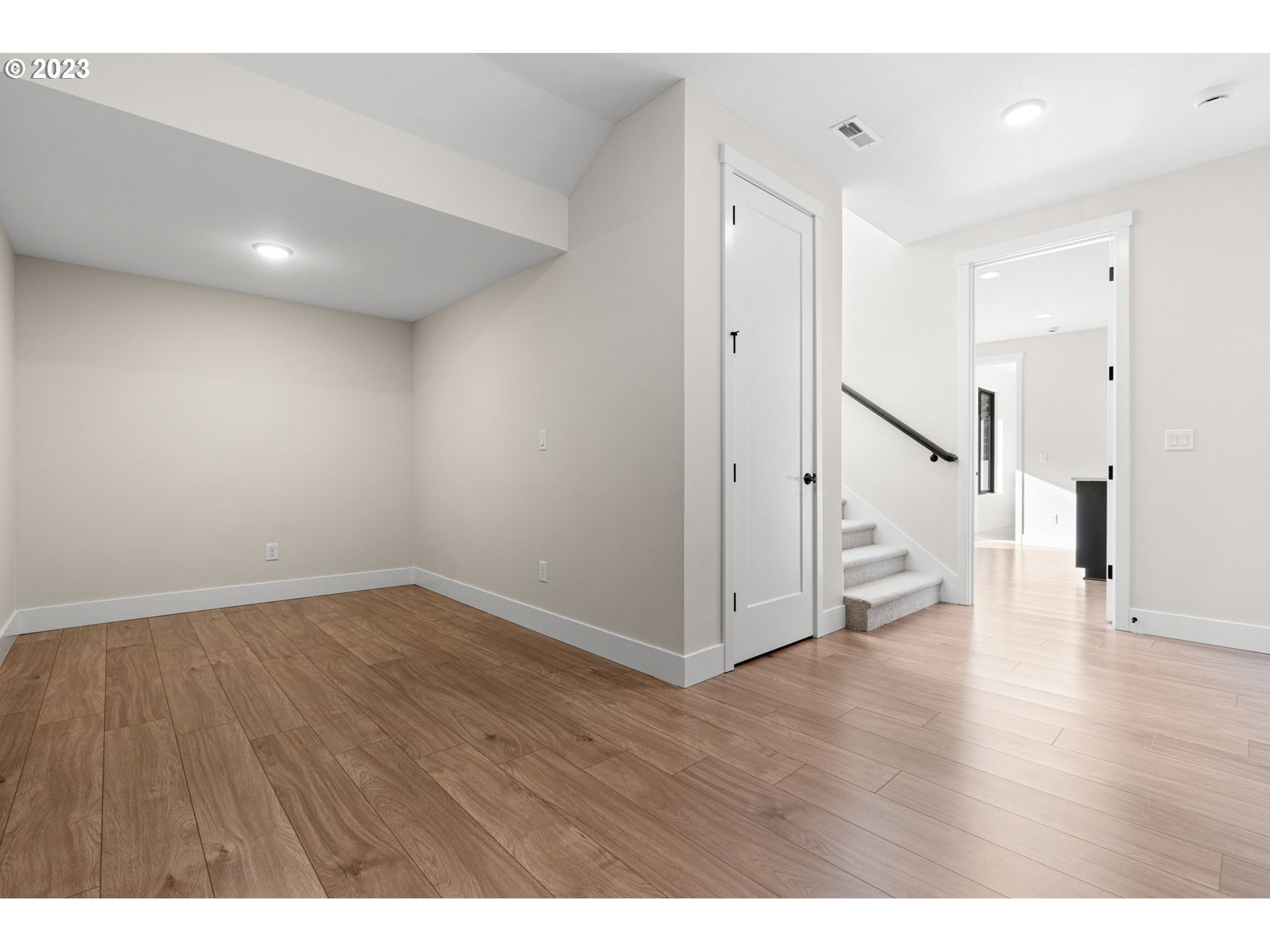 6622 Southeast Riverside Drive Vancouver, WA 98661 - Photo 37 of 46 a view of an empty room with wooden floor and stairs