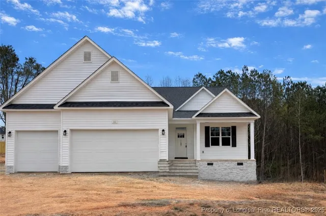 a front view of a house with a garage
