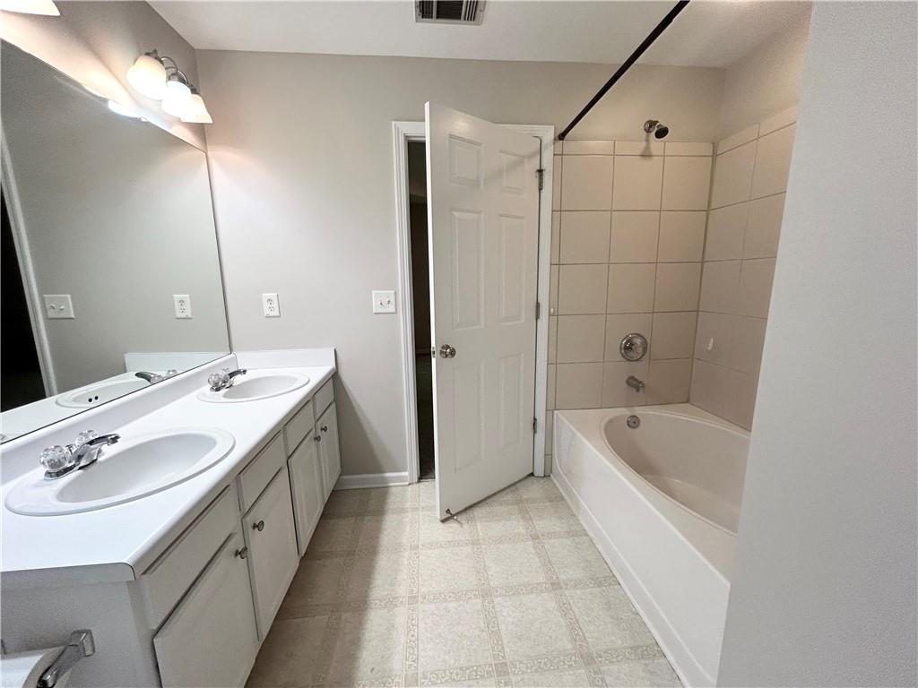 3647 Postwaite Circle Northwest Duluth, GA 30097 - Photo 11 of 20 a spacious bathroom with a tub sink and mirror