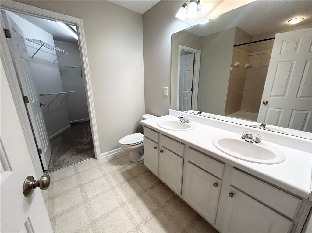 3647 Postwaite Circle Northwest Duluth, GA 30097 - Photo 10 of 20 a bathroom with a double vanity sink toilet and shower