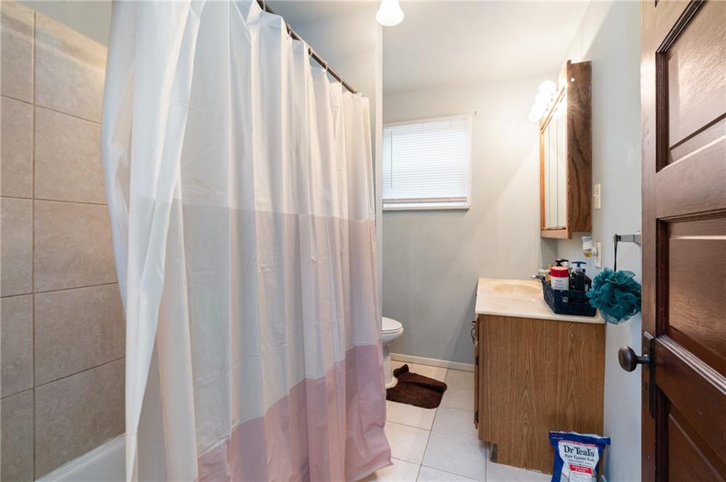 1412 4th Avenue Coraopolis, PA 15108 - Photo 11 of 14 a room with a window and flower pot