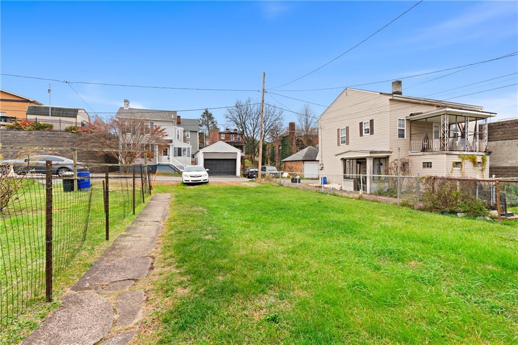 1412 4th Avenue Coraopolis, PA 15108 - Photo 12 of 14 a view of a house with a yard and sitting area