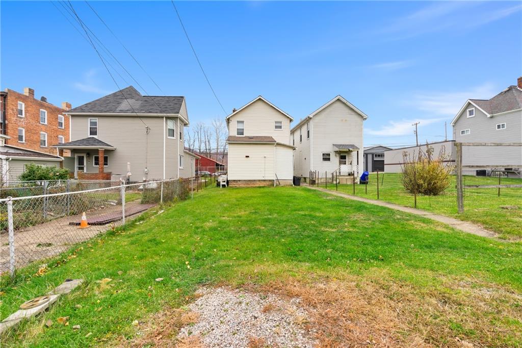 1412 4th Avenue Coraopolis, PA 15108 - Photo 13 of 14 a front view of a house with garden