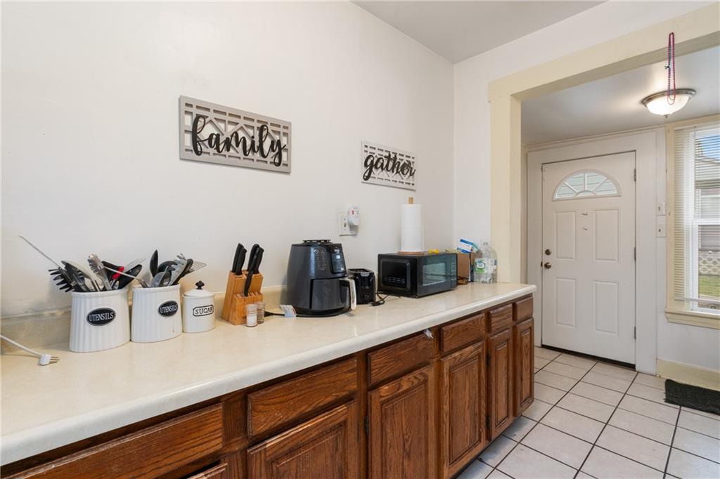 1412 4th Avenue Coraopolis, PA 15108 - Photo 7 of 14 a kitchen with a sink and cabinets