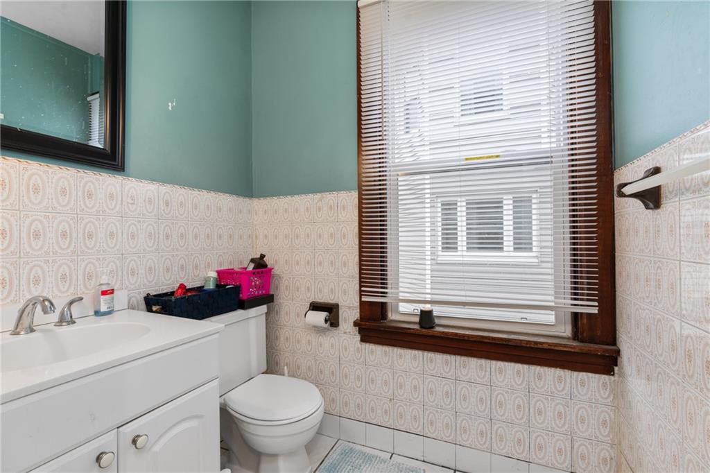 1412 4th Avenue Coraopolis, PA 15108 - Photo 8 of 14 a bathroom with a sink toilet and a window