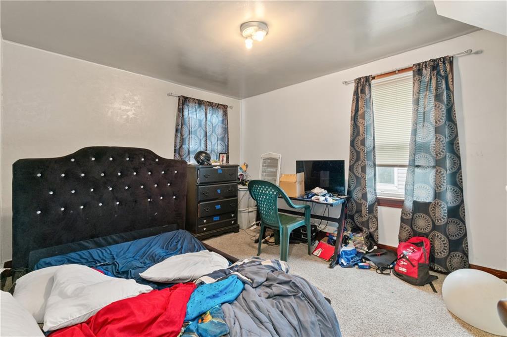 1412 4th Avenue Coraopolis, PA 15108 - Photo 10 of 14 a bedroom with furniture and a large window