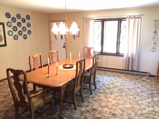 6615 Kemman Road Hebron, IL 60034 - Photo 13 of 25 a view of a dining room with furniture and chandelier