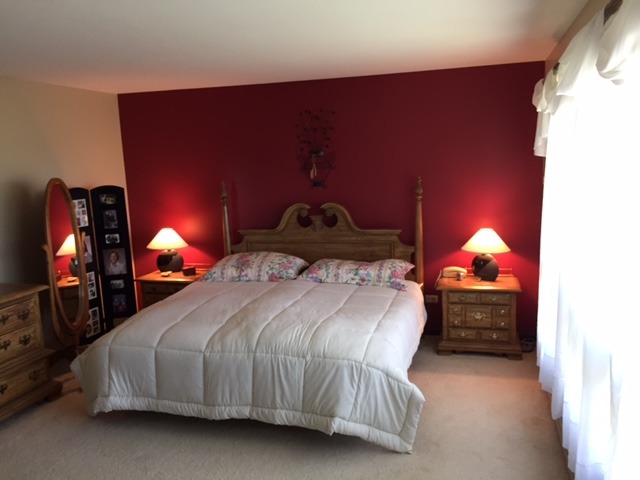 6615 Kemman Road Hebron, IL 60034 - Photo 16 of 25 a bedroom with a bed and a lamp