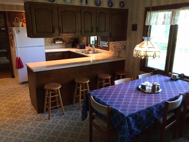 6615 Kemman Road Hebron, IL 60034 - Photo 18 of 25 a kitchen with a sink cabinets and window