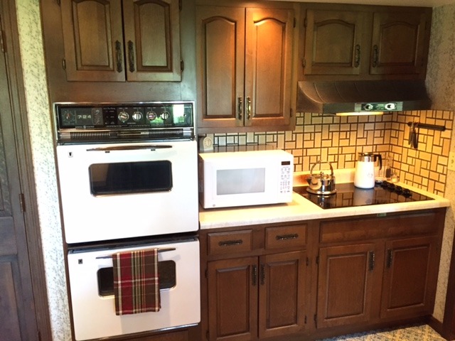 6615 Kemman Road Hebron, IL 60034 - Photo 20 of 25 a kitchen with stainless steel appliances granite countertop a sink and cabinets