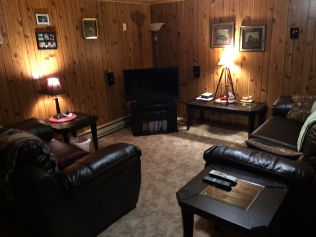 6615 Kemman Road Hebron, IL 60034 - Photo 21 of 25 a living room with furniture fireplace and a window