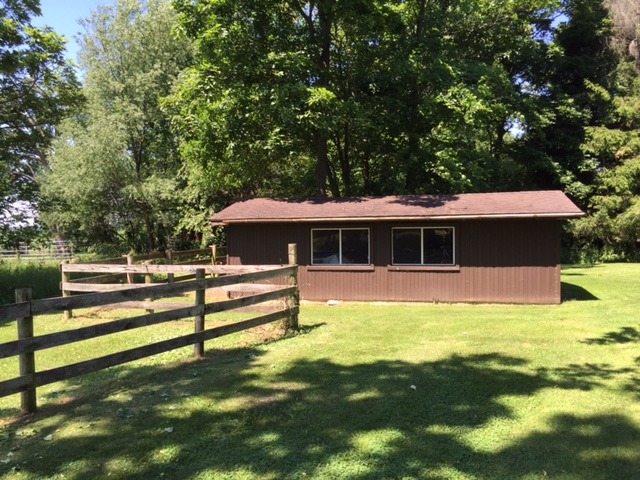 6615 Kemman Road Hebron, IL 60034 - Photo 22 of 25 a view of a house with a yard