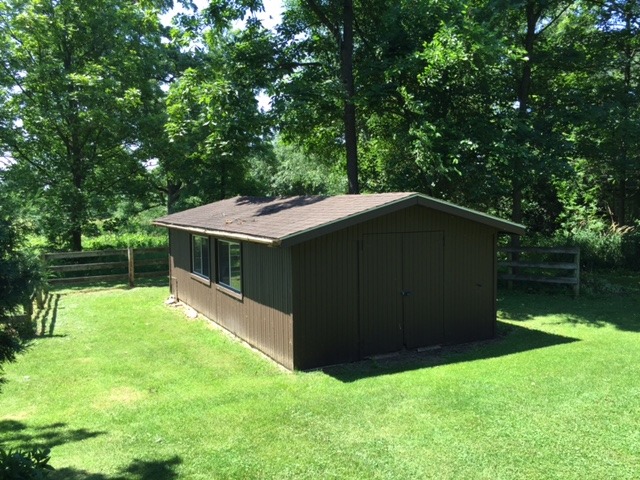 6615 Kemman Road Hebron, IL 60034 - Photo 23 of 25 a backyard of a house with lots of green space