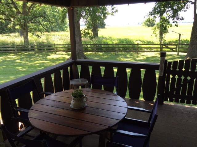 6615 Kemman Road Hebron, IL 60034 - Photo 8 of 25 a view of a balcony with lake view and wooden floor