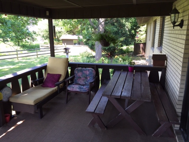 6615 Kemman Road Hebron, IL 60034 - Photo 10 of 25 a view of a patio with wooden floor and outdoor seating