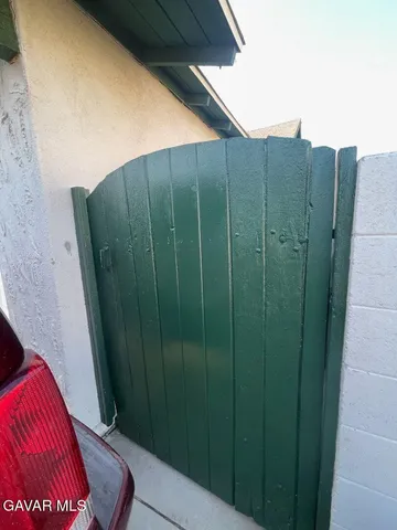 a view of a backyard with potted plants