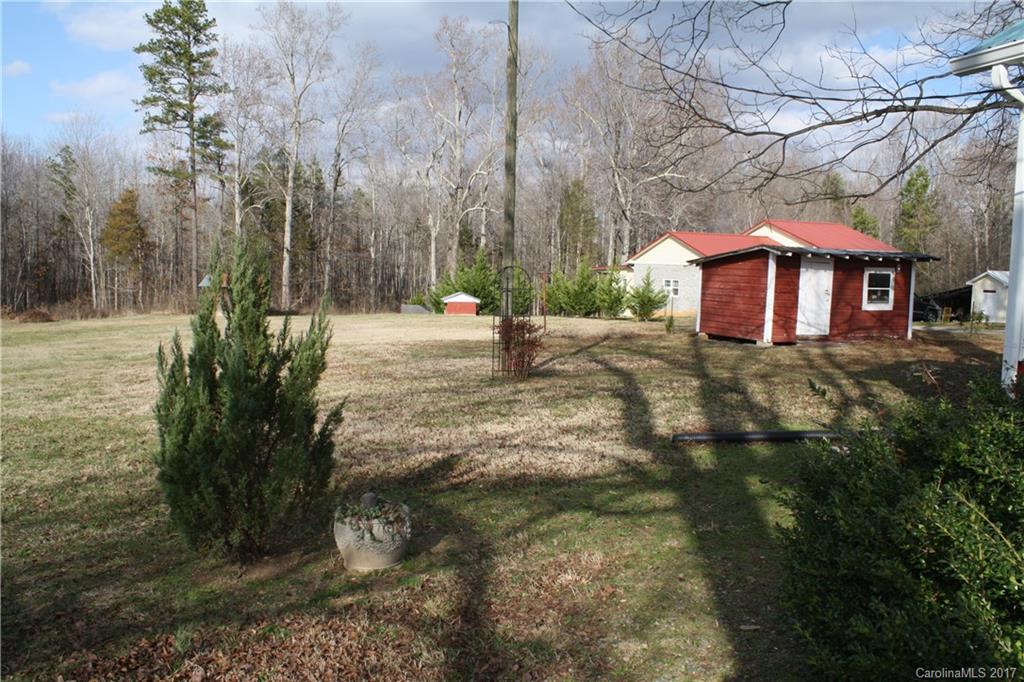 1460 Needmore Road Woodleaf, NC 27054 - Photo 14 of 16 a view of a house with a yard