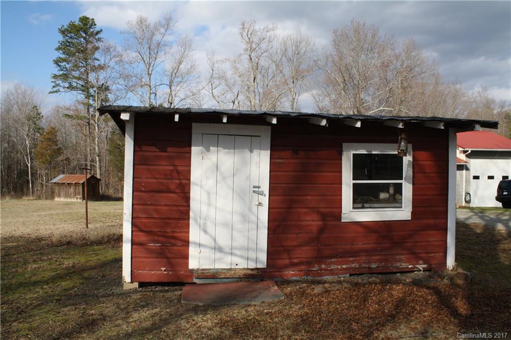 1460 Needmore Road Woodleaf, NC 27054 - Photo 15 of 16 a front view of a house with a yard