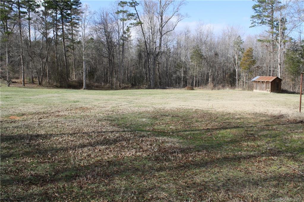 1460 Needmore Road Woodleaf, NC 27054 - Photo 16 of 16 a backyard of a house with trees