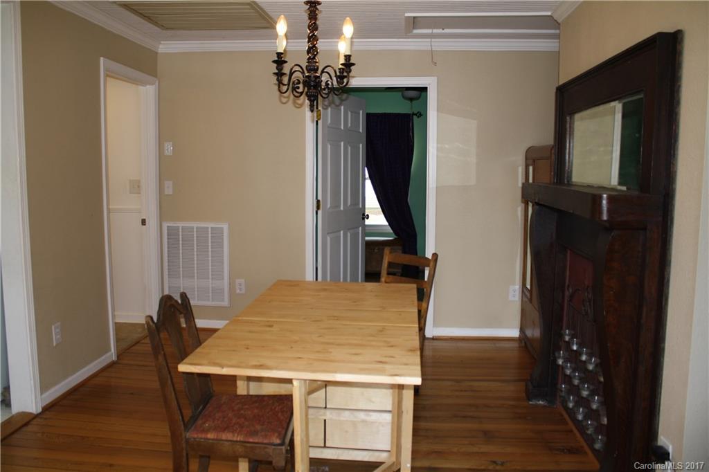 1460 Needmore Road Woodleaf, NC 27054 - Photo 4 of 16 a view of a dining room with furniture and wooden floor