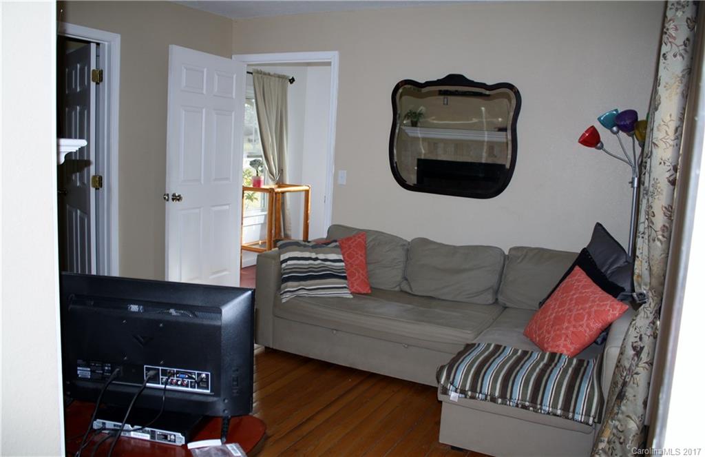 1460 Needmore Road Woodleaf, NC 27054 - Photo 8 of 16 a living room with furniture and a wooden floor