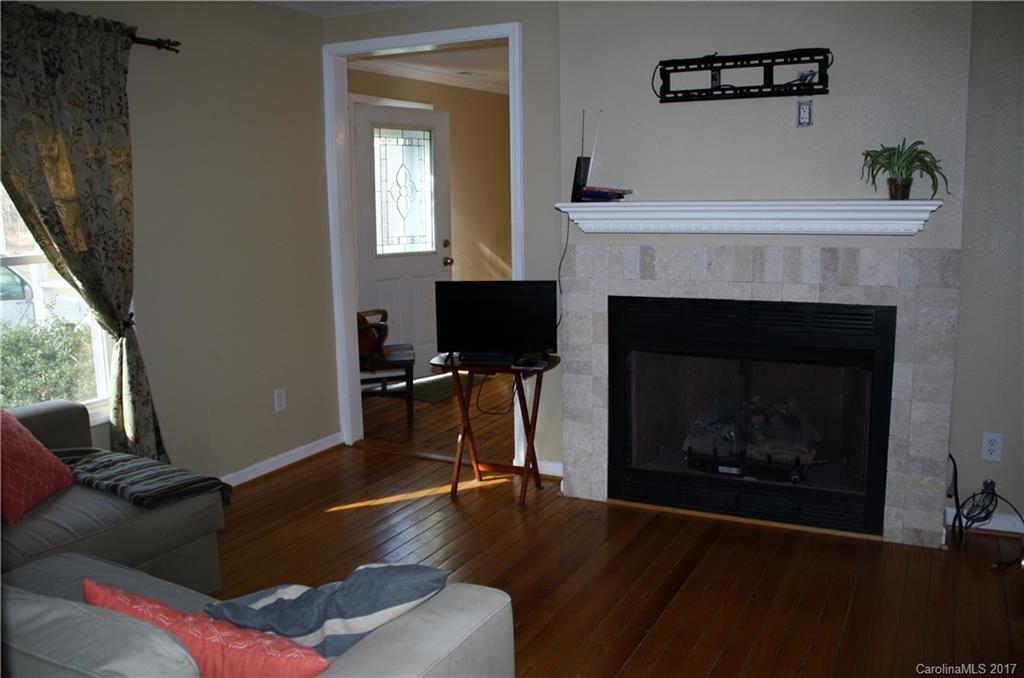 1460 Needmore Road Woodleaf, NC 27054 - Photo 10 of 16 a living room with furniture and a fireplace
