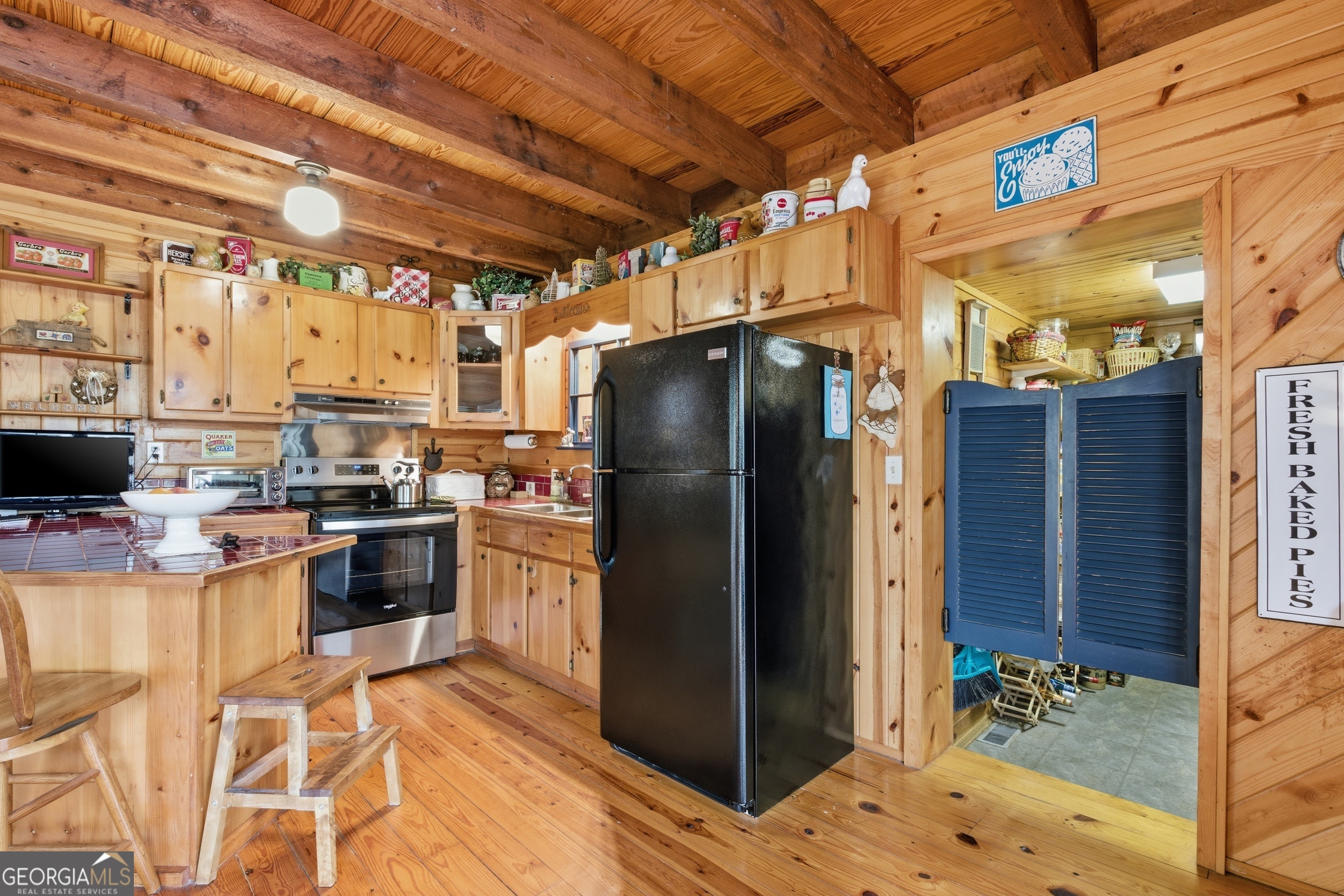 801 Sillycook Trail Clarkesville, GA 30523 - Photo 11 of 47 a kitchen with stainless steel appliances granite countertop a refrigerator and a stove