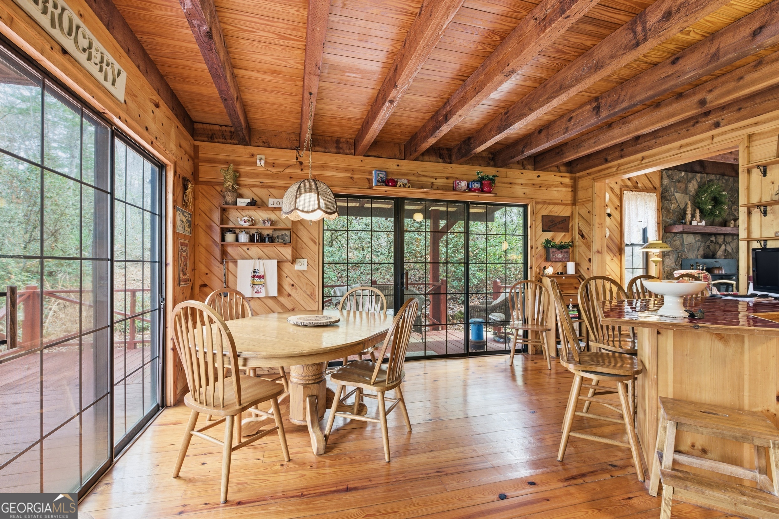 801 Sillycook Trail Clarkesville, GA 30523 - Photo 12 of 47 a dining room with wooden floor glass table and chairs