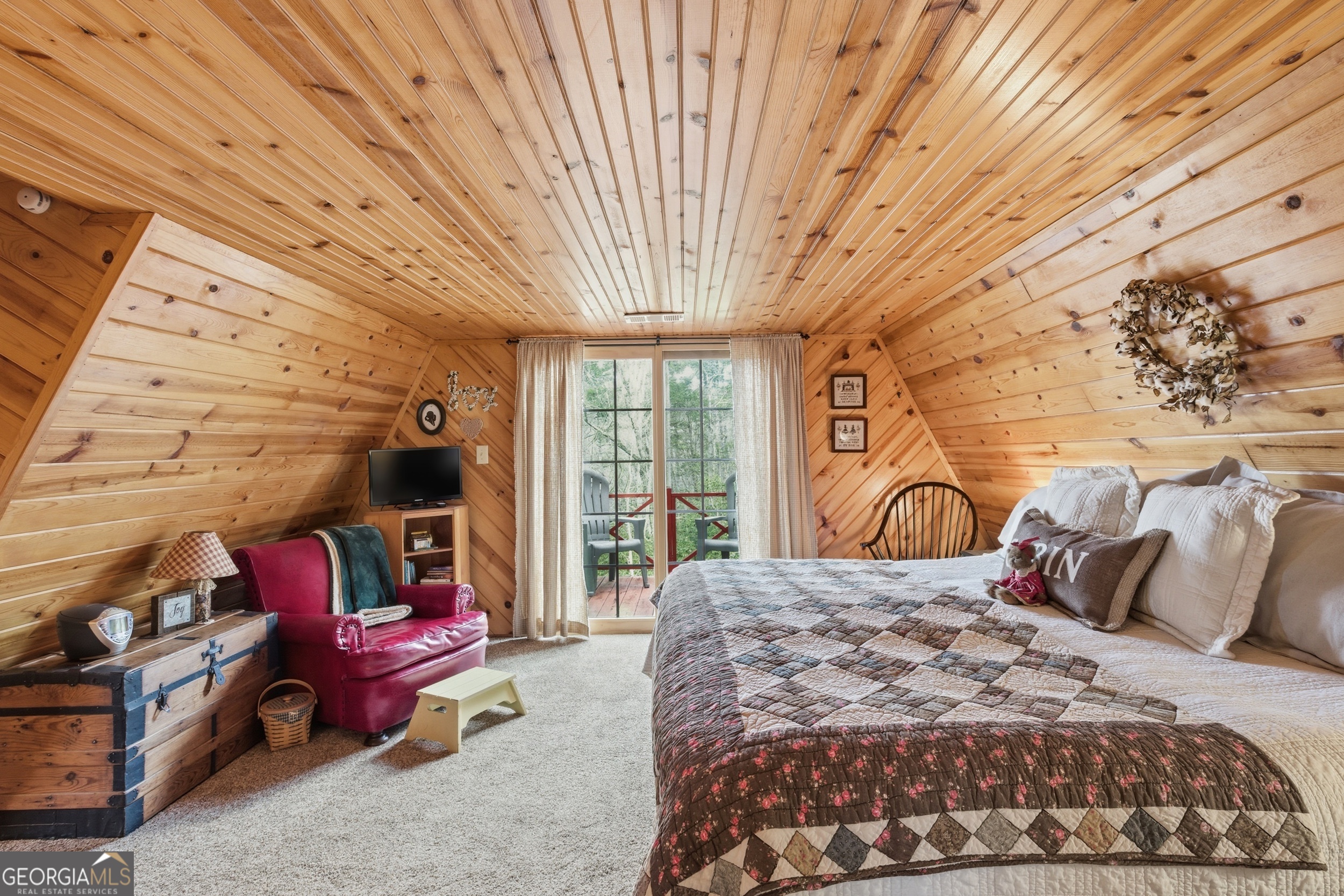 801 Sillycook Trail Clarkesville, GA 30523 - Photo 23 of 47 a bedroom with a bed and a couch