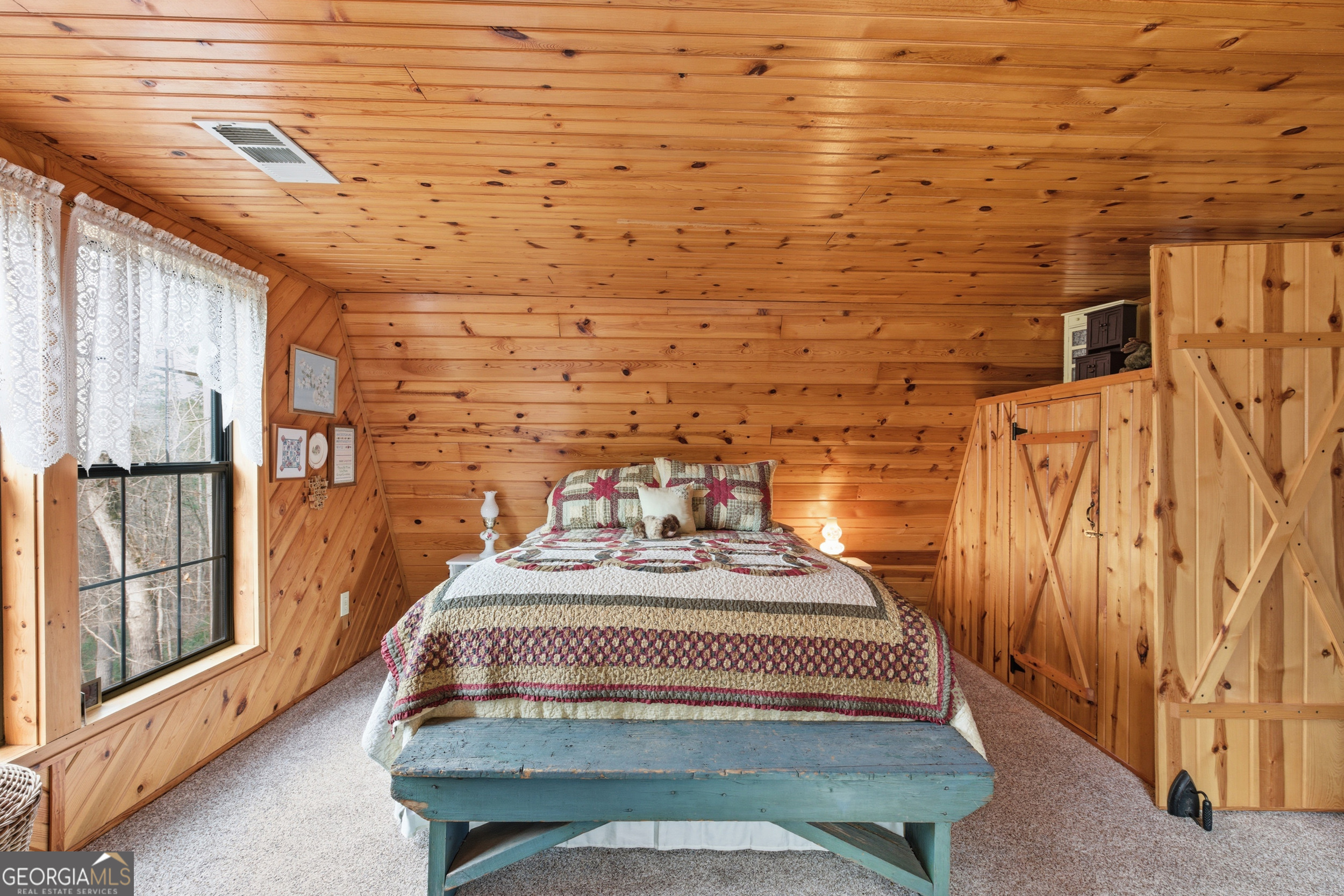 801 Sillycook Trail Clarkesville, GA 30523 - Photo 32 of 47 a bedroom with a bed and wooden floor