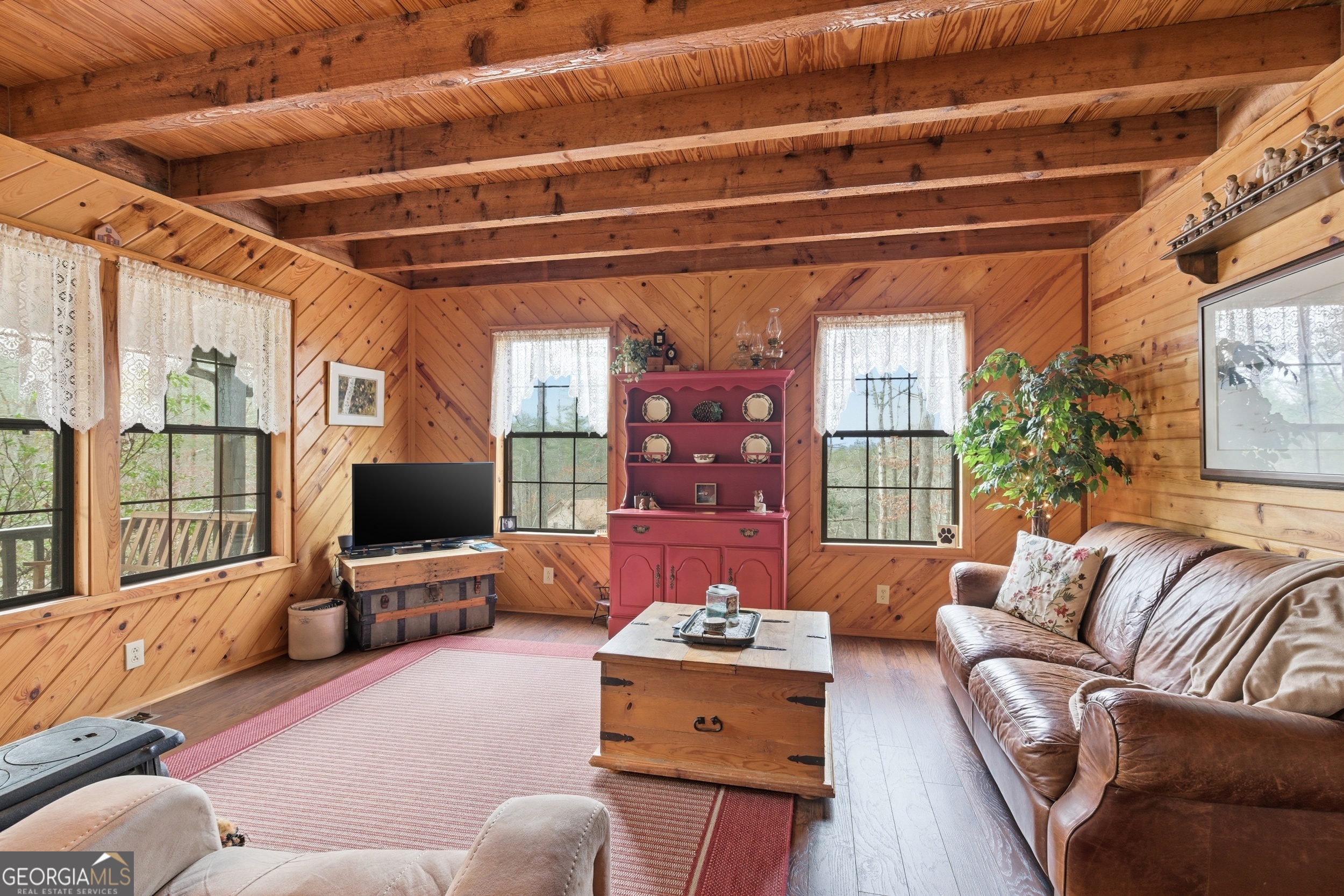801 Sillycook Trail Clarkesville, GA 30523 - Photo 9 of 47 a living room with furniture and a flat screen tv