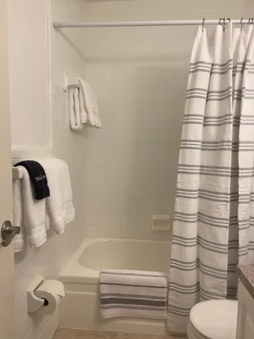 a bathroom with a bathtub and shower